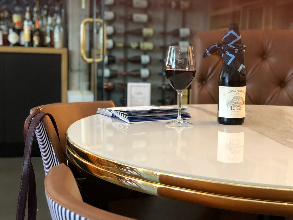 Bottle drapes collection page inspiration of man with paint soaked pants facing wall painting mural of many canvases